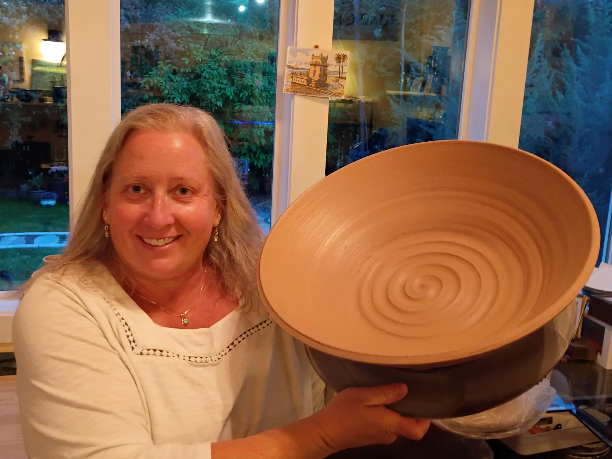 Kim Blais shaping clay at the wheel